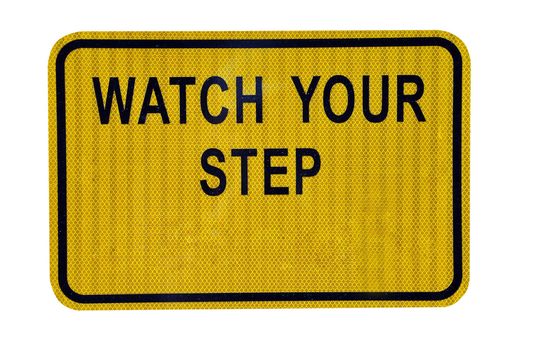 "Watch Your Step" sign isolated on white background with clipping path.  Copy space on sign.