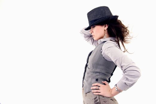 Portrait of a young beautiful brunette in hat over white