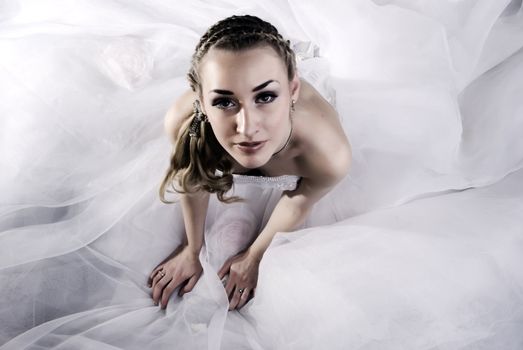 Young beautiful bride in wedding dress symbolizing innocence and family