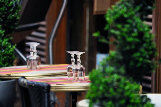 Tables and chairs in empty cafe. Photo with tilt-shift effect
