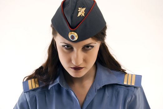 Young beautiful woman in police uniform being strict and serious