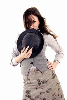Portrait of a young beautiful brunette posing with hat