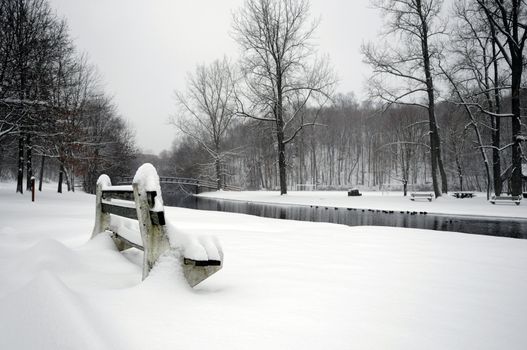 A local park fully covered with snofall in winer