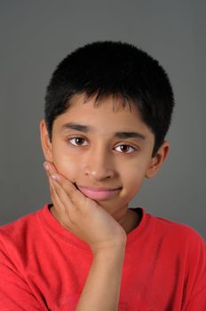a Handsome Indian kid smiling for you