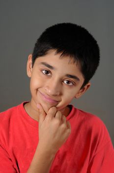 a Handsome Indian kid smiling for you