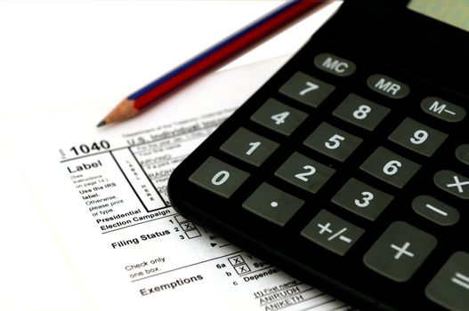 A copy of 1040 form and calculator for tax filing