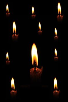 Bright candle isolated on a dark background