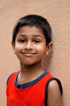 An handsome kid posing in front of the camera