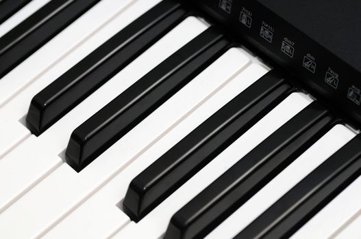 Close up photo of a black and white piano keys