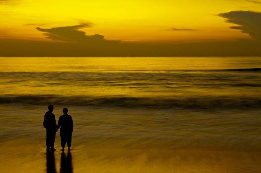 Father and son having intimacy at a local beach