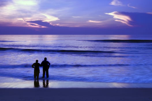 A young couple having fun at a tropicla beach