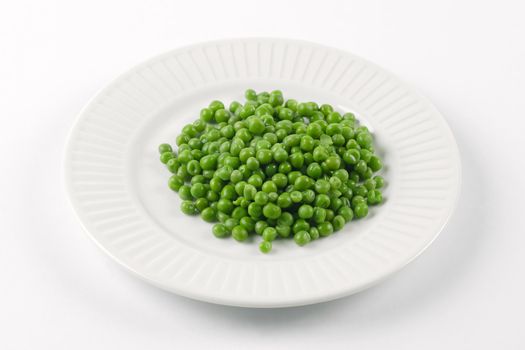 Photo of a plate of green peas.