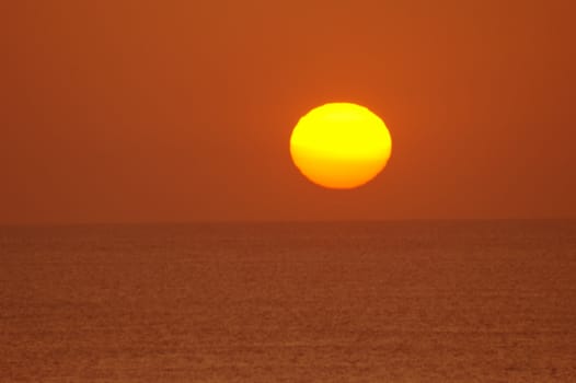 Sun setting over the ocean in Cornwall England