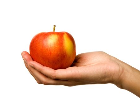 A handing holding out an apple