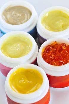 Colorful jars of skin care creams and lotions