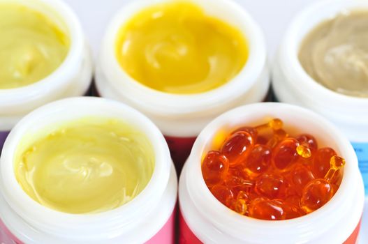 Colorful jars of skin care creams and lotions