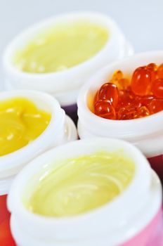 Colorful jars of skin care creams and lotions