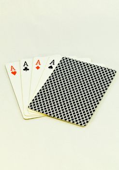 Fiver poker cards with four aces and a hidden card