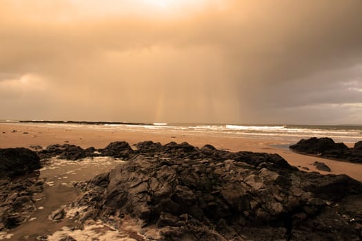 ballybunion beach as a storm gathers power on the horizon
