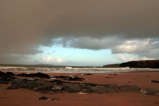 ballybunion beach as a storm gathers power on the horizon