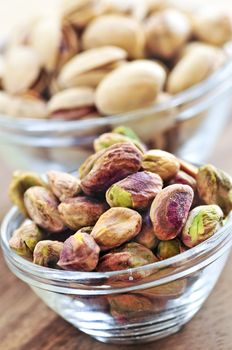 Close up of pistachio nuts in glass bowls