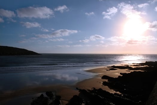 the waves with reflection crashing in on youghal beach ireland