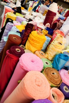 Rolld of cloth at a textile store, bulk