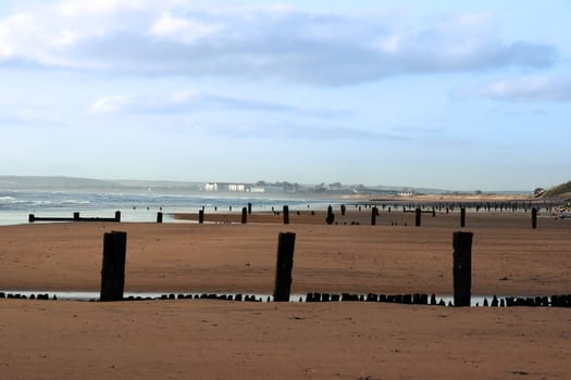 wave breakers on a beach in youghal county cork ireland