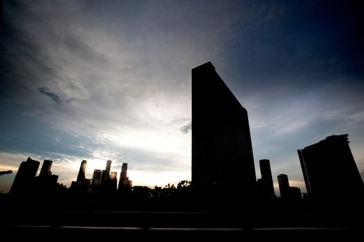 Singpore skyline in dramatic clouds - silhouette