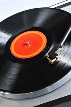 Vinyl record spinning on turntable close up