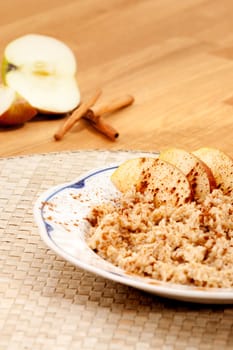 Apple Cinnamon Porridge with fresh ingredients in the background