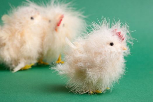 A little yellow chick easter decoration isolated on green