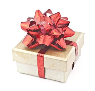 On white-gold gift box with red ribbon.