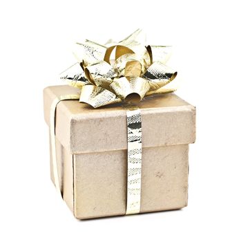 On white-gold gift box with gold ribbon.
