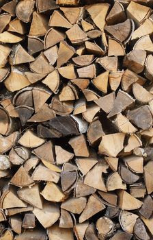 Background - the Stack of fire wood from birch logs