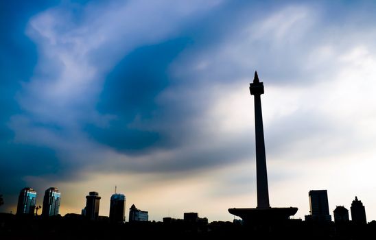 Jakarta National Monument skyline with blue cloudy sky