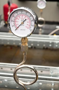 Industrial hydraulic round barometer with rain over it