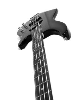 Black bass guitar on white fluffy drapery