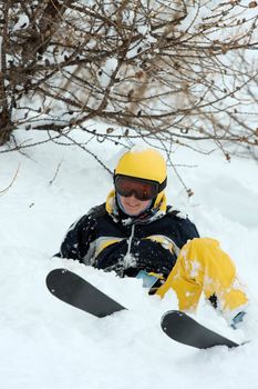 Female skier coming down a wild slope with deep snow