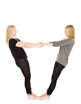 Two girls holding each others hands