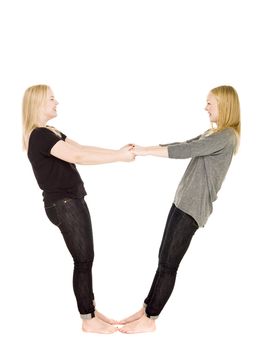 Two girls holding each others hands
