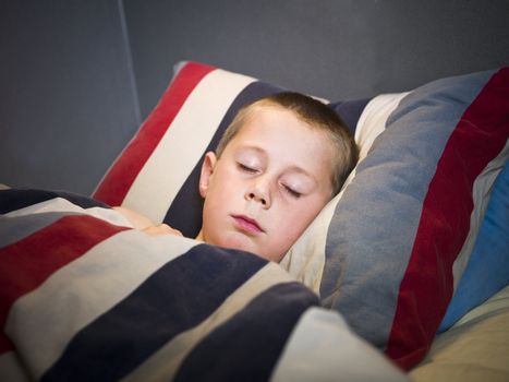 Young Boy sleeping in his bed