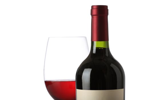 Red wine bottle with and empty label and glass