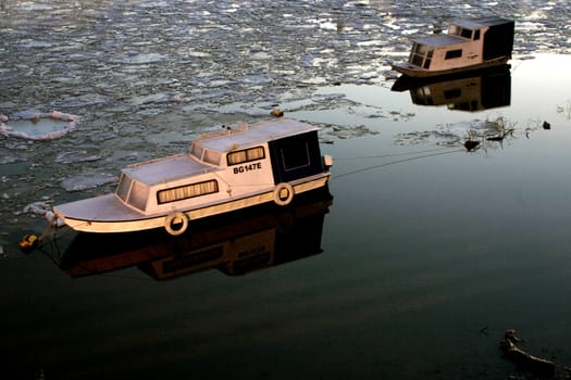 Two Boats on river in Belgrade, winter dawn