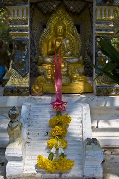 small golden statue of Buddha in Thailand