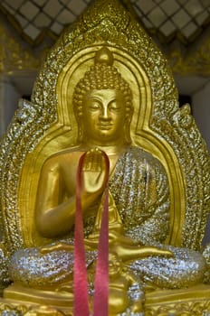 small golden statue of Buddha in Thailand