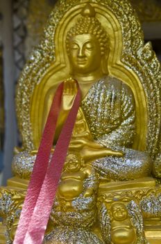 small golden statue of Buddha in Thailand