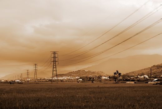 There are some electric towers on the farm.