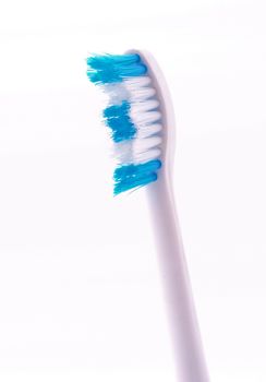 Tooth brush on a plain white background.