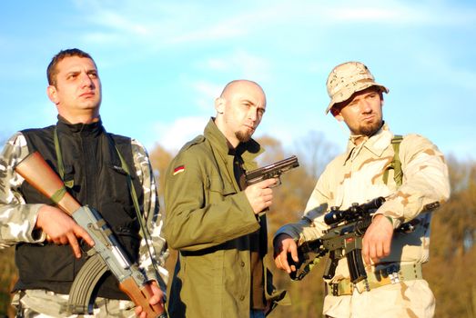 three kind of soldiers posing military movie poster like